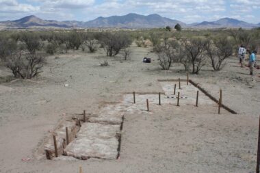 Excavations within Feature 18, an area of stained soil, revealed trenches and postholes for mission-period animal pens and fences at the Guevavi Mission. Modern posts have been placed in postholes to show their location