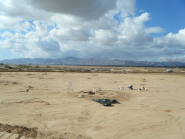 Overview of an excavated portion of the Luke Solar project area, with the White Tank Mountains in the background