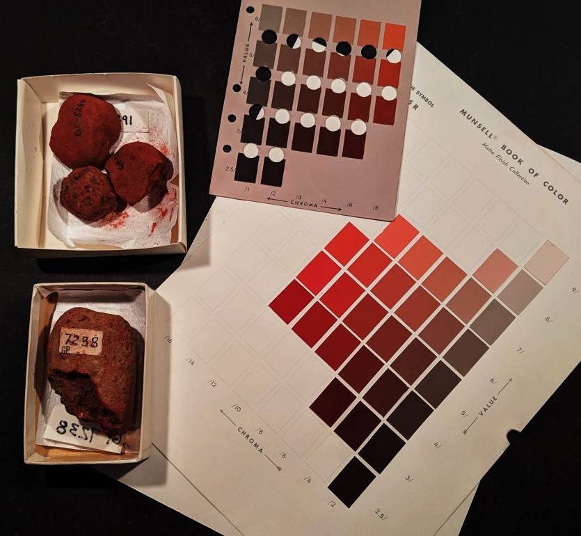 Examples of red archaeological paint cakes with Munsell color chart sheets